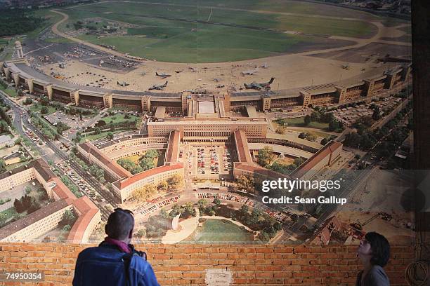 Journalists look at a giant aerial photograph of Tempelhof Airport at the airport June 29, 2007 in Berlin, Germany. Tempelhof Airport, first built in...