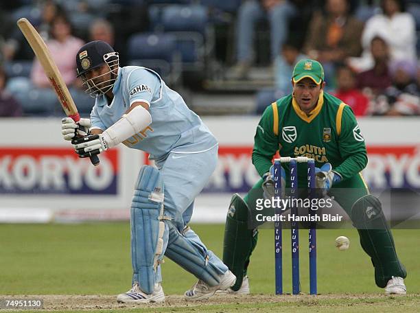 Sachin Tendulkar of India turns the ball to mid wicket with Mark Boucher of South Africa looking on during the second One Day International match...
