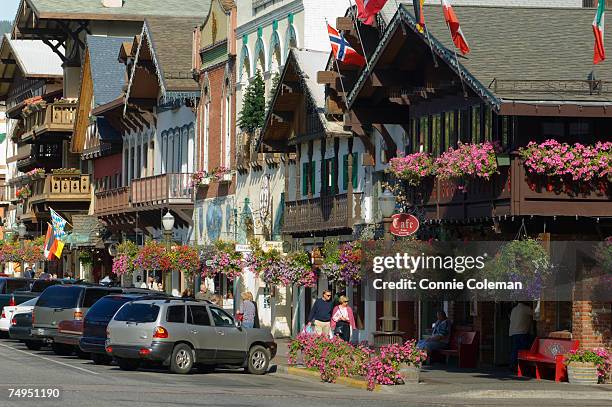 people walking in street of bavarian style village - leavenworth washington stock pictures, royalty-free photos & images