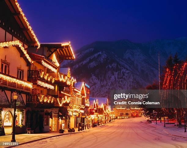 bavarian style village near cascade mountains decorated with christmas lights - washington state road stock pictures, royalty-free photos & images