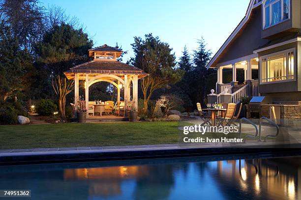 home exterior at dusk with gazebo and pool - terrace british columbia stock pictures, royalty-free photos & images