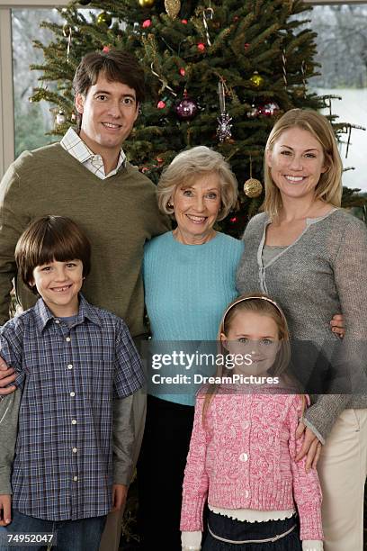 multi-generation family, smiling, portrait - christmas tree close up stock pictures, royalty-free photos & images