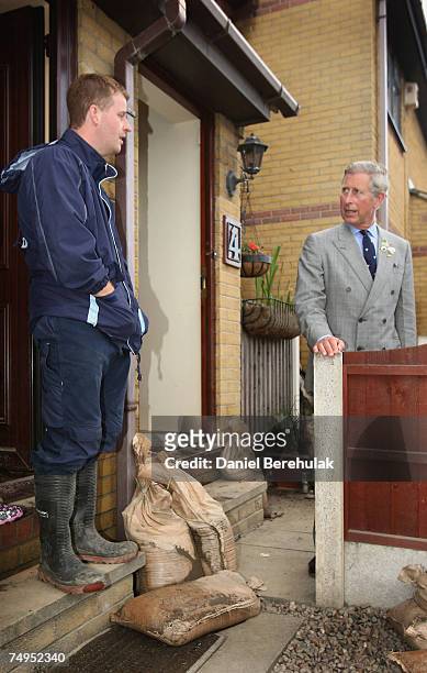 Prince Charles, Prince of Wales speaks with local resident Russell Baxter during a visit to flood effected areas on June 29, 2007 in Catcliffe near...