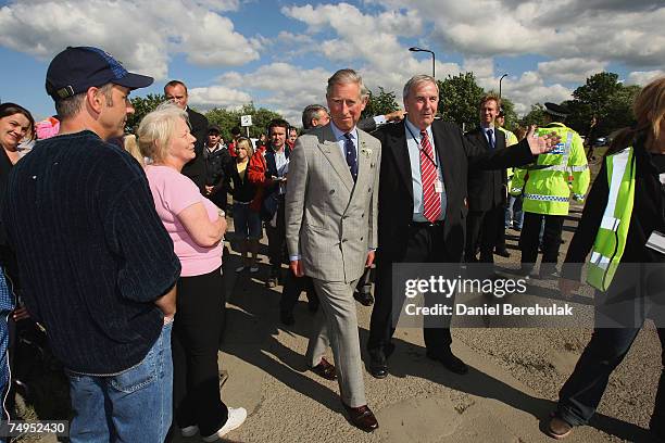 Prince Charles, Prince of Wales walks during a visit to flood effected areas on June 29, 2007 in Catcliffe near Sheffield, England. The area has been...