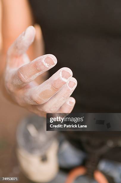 rock climber with chalk on hand - chalk bag stock-fotos und bilder