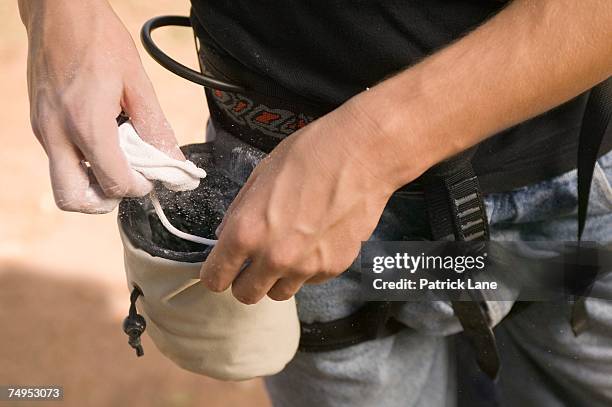 rock climber with chalk bag and chalk - chalk bag stock pictures, royalty-free photos & images