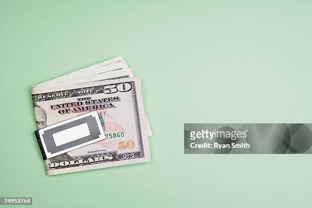 folded dollars in a money clip - greedy smith 個照片及圖片檔