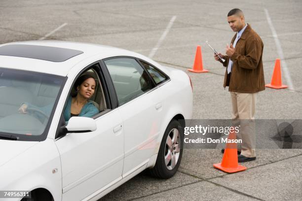 african teenager taking drivers test - learning to drive ストックフォトと画像