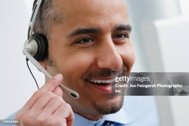 middle eastern businessman wearing headset - arab call center stock pictures, royalty-free photos & images