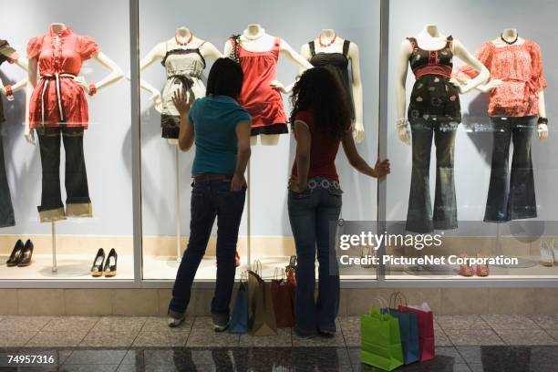 multi-ethnic teenage girls window shopping - girl of desire stock pictures, royalty-free photos & images