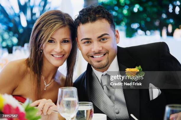 multi-ethnic couple at wedding - boutonniere ストックフォトと画像