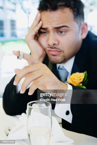 hispanic groom looking sad - sad groom stock pictures, royalty-free photos & images