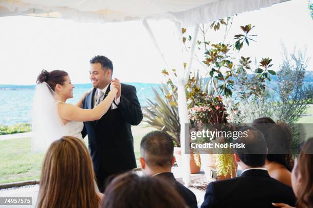 multi-ethnic bride and groom dancing - dancing for ned stock pictures, royalty-free photos & images