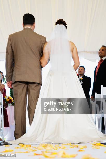 bride being walked down aisle - bride father stock pictures, royalty-free photos & images