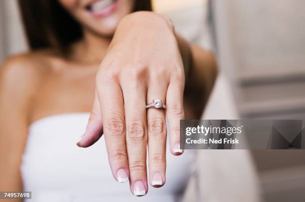 bride showing off ring - engagement ring stock-fotos und bilder