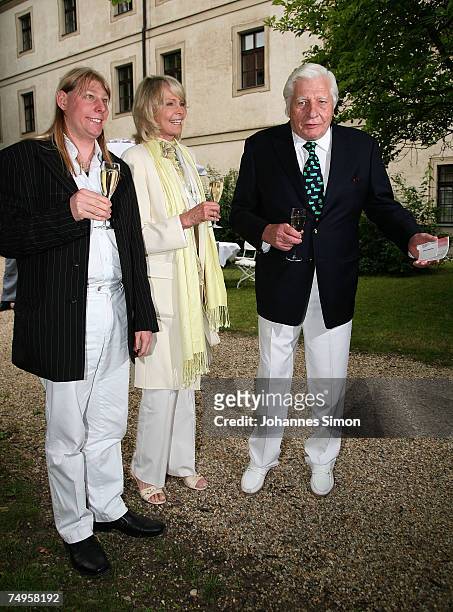Gunther Sachs, his wife Mirja and son Halifax Sachs attend the operetta "Weisses Roessl" at the Thurn und Taxis castle festival on June 29 in...