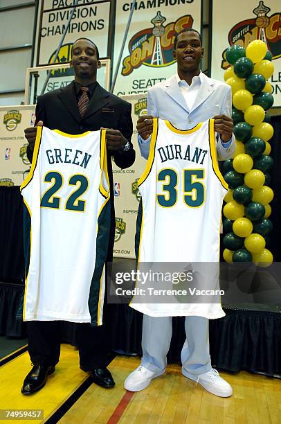 Kevin Durant and Jeff Green of the Seattle SuperSonics hold up their new jerseys during a press conference held at the Furtado Center June 29, 2007...