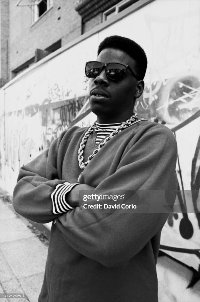 Scooly Rapper American rapper Schoolly D poses in front of a graffiti tagged wall ...