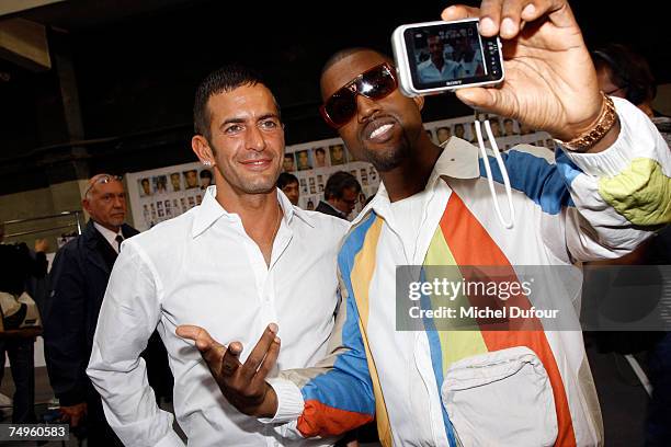 Kanye West and Marc Jacobs attend the Vuitton Fashion show during Paris Menswear Fashion Week Spring-Summer 2008 at the Paris Tennis Club on June 29,...