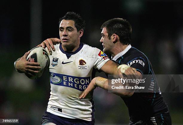 Corey Parker of the Broncos is tackled by Tim Grant of the Panthers during the round 16 NRL match between the Penrith Panthers and the Brisbane...