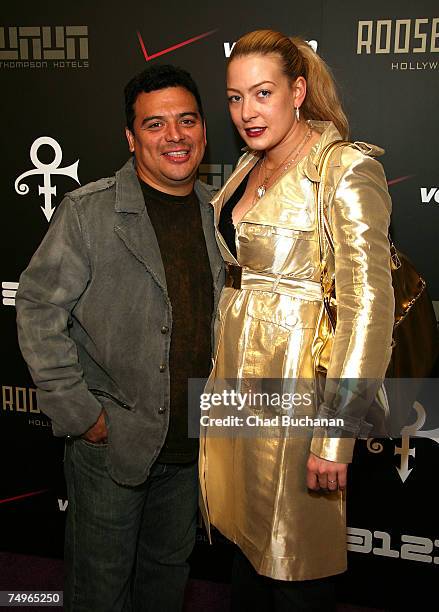 Comedian Carlos Mencia and wife Amy attend Prince's "3121" live at The Hollywood Roosevelt Hotel on June 29, 2007 in Los Angeles, California.