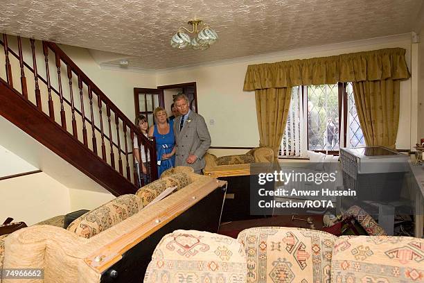 Prince Charles, Prince of Wales sees flood damage in the home of the Breeze family during a visit to flood effected areas on June 29, 2007 in...