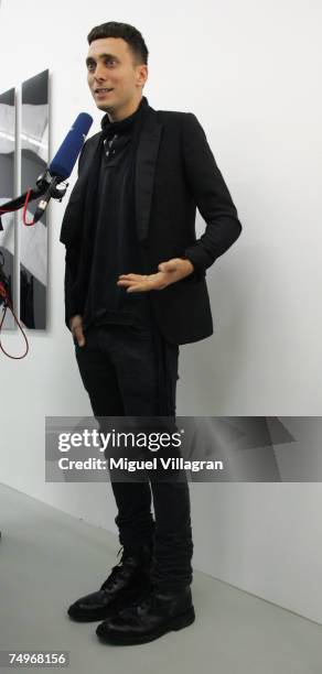 Artist and fashion designer Hedi Slimane talks to the media, during a group show curated by him at gallery Arndt & Partner on June 30, 2007 in...