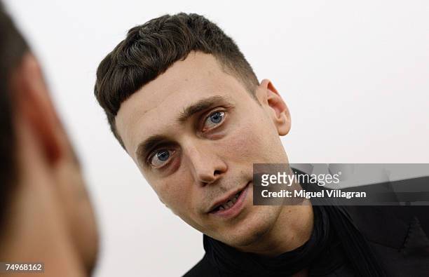 Artist and fashion designer Hedi Slimane talks to the media, during a group show curated by him at gallery Arndt & Partner on June 30, 2007 in...