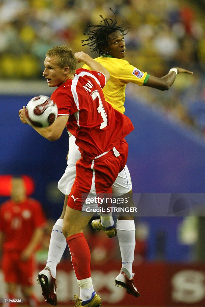 Poland's Jaroslaw Fojut (L) and Brazil's...