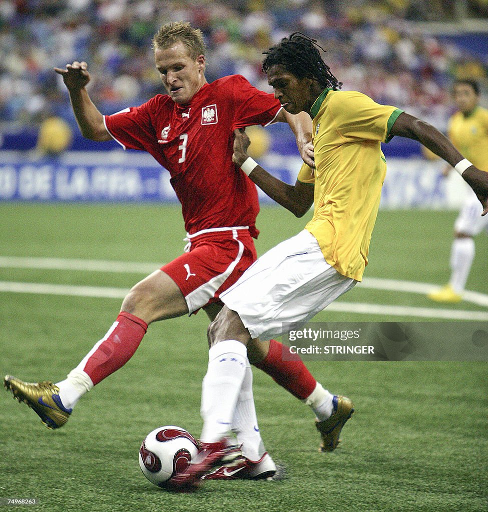 Poland's Jaroslaw Fojut (L) and Brazil's...