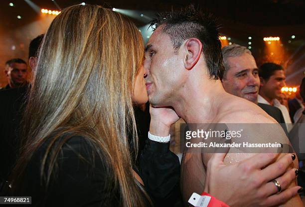 Felix Sturm of Germany kisses his wife Jasmin Catic after winning his WBA World Championship fight between Felix Sturm of Germany and Noe Tulio...