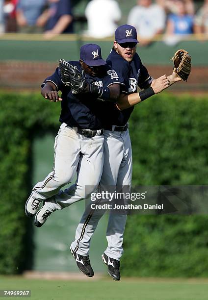 Bill Hall and Corey Hart of the Milwaukee Brewers celebrate a win over the Chicago Cubs on June 30, 2007 at Wrigley Field in Chicago, Illinois.