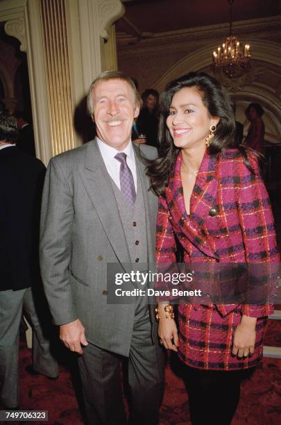 British entertainer Bruce Forsyth with his third wife, Wilnelia Merced, 9th December 1990.
