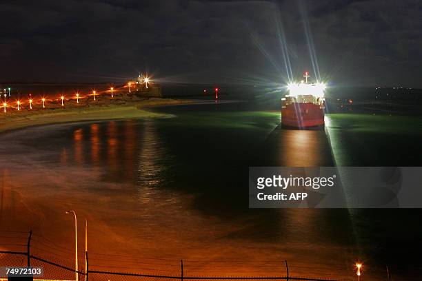 The 40,000 tonne coal ship Pasha Bulker is seen being pulled away from Nobby's beach North from Sydney, 01 July 2007. The massive coal carrier Pasha...
