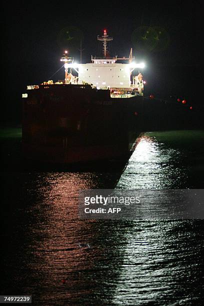 The 40,000 coal ship Pasha Bulker is pulled away from Nobby's beach North from Sydney, 01 July 2007. The massive coal carrier Pasha Bulker stranded...