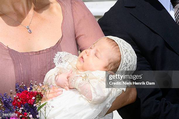 Princess Mary of Denmark holds baby daughter Princess Isabella of Denmark at the Fredensborg Palace Church for her christening on July 1, 2007 in...