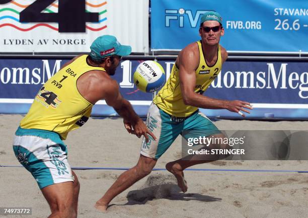 Brazil's winners Fabio Luiz and Marcio Araujo are seen during the Grand Slam Beach Volleyball tournament finals against Dutch Richard Schuil and...