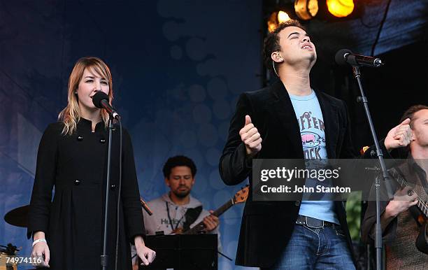 Singer Guy Sebastian and girlfriend Julie Egan perform at the event marking the Sydney arrival of The World Youth Day Cross and Icon, at Tumbalong...