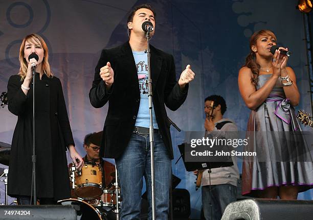 Singers Guy Sebastian and Paulini, and Julie Egan perform the World Youth Day song,"Receive The Power" written by Guy, at the event marking the...