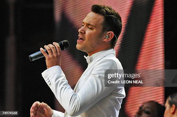 London, UNITED KINGDOM: British pop singer Will Young performs on stage at Wembley stadium in north London, 01 July 2007, as 60,000 revellers join...