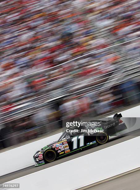 Denny Hamlin, driver of the FedEx Ground Chevrolet, races during the NASCAR Nextel Cup Series Lenox Industrial Tools 300 at New Hampshire...