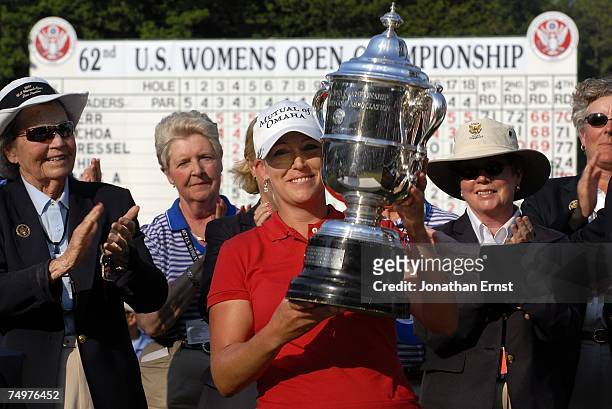 Cristie Kerr celebrates with the trophy after her 2-stroke victory at the U.S. Women's Open Championship at Pine Needles Lodge & Golf Club on July 1,...