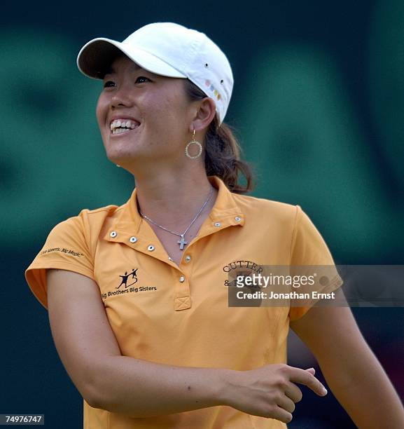 Angela Park celebrates a birdie on the 18th hole during the final round of the U.S. Women's Open Championship at Pine Needles Lodge & Golf Club on...