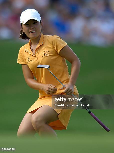 Angela Park celebrates a birdie on the 18th hole during the final round of the U.S. Women's Open Championship at Pine Needles Lodge & Golf Club on...