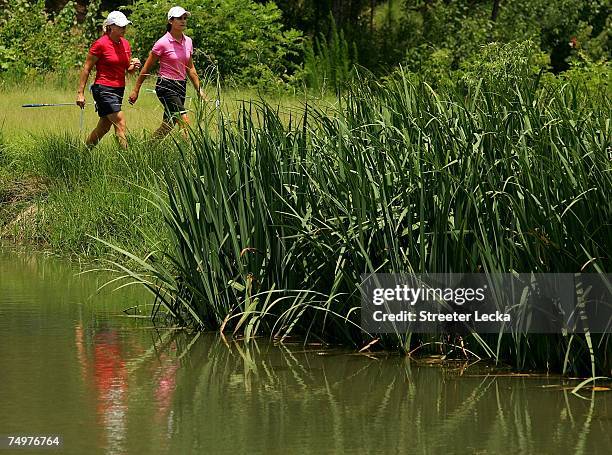 Lorena Ochoa of Mexico and Cristie Kerr walk together to the 3rd green during the final round of the U.S. Women's Open Championship at Pine Needles...