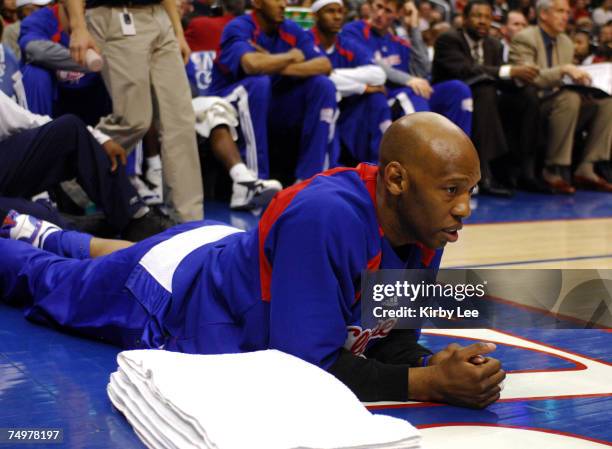 Sam Cassell of the Los Angeles Clippers watches from the baseline with a back injury during 92-87 loss to the Houston Rockets in NBA game at the...