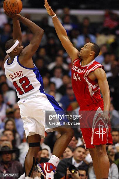 Elton Brand of the Los Angeles Clippers shoots over Chuck Hayes of the Houston Rockets in NBA game at the Staples Center in Los Angeles, Calif. On...