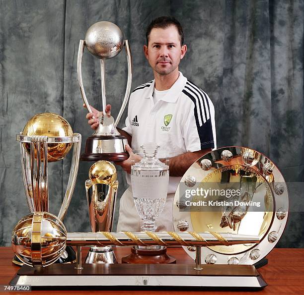 Australian captain Ricky Ponting poses with the 2007 ICC Cricket World Cup trophy, the 2007 ICC Champions Trophy, The Ashes Trophy, the ICC One Day...