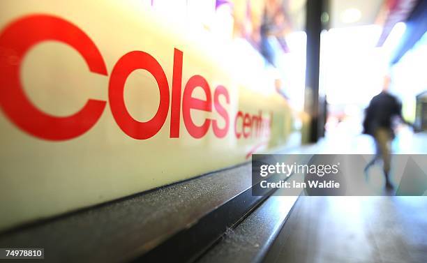 Pedestrian walks past a Coles supermarket after the announcement of Wesfarmers takeover bid July 2, 2007 in Sydney, Australia. The deal, recommended...