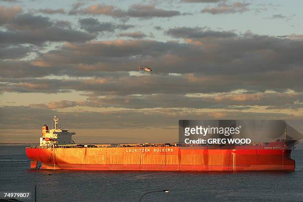The massive coal carrier Pasha Bulker is seen stranded an Australian beach in Newcastle, New South Wales, 02 July 2007. The coal carrier was close to...